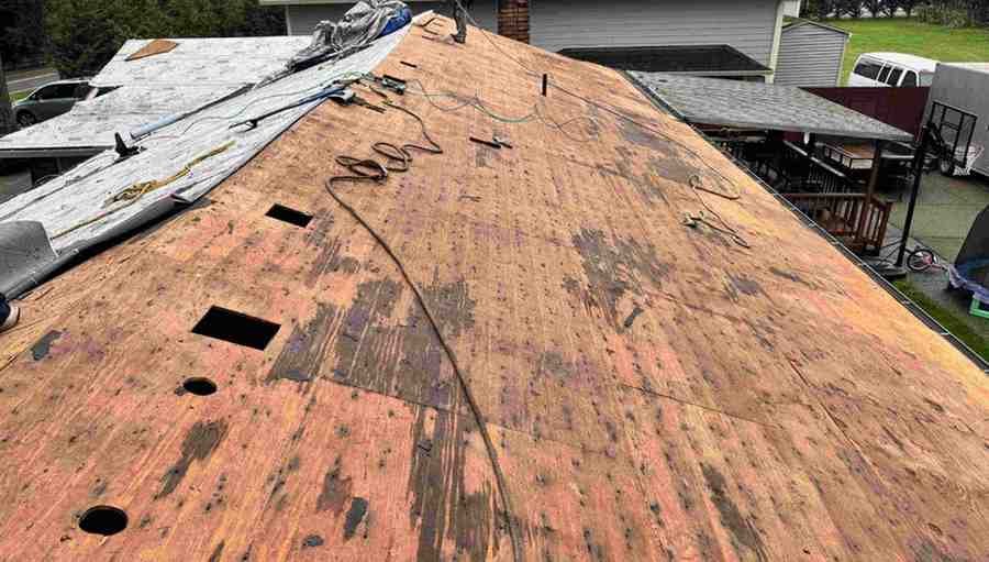 Roof stripped to bare plywood decking during a roof replacement project