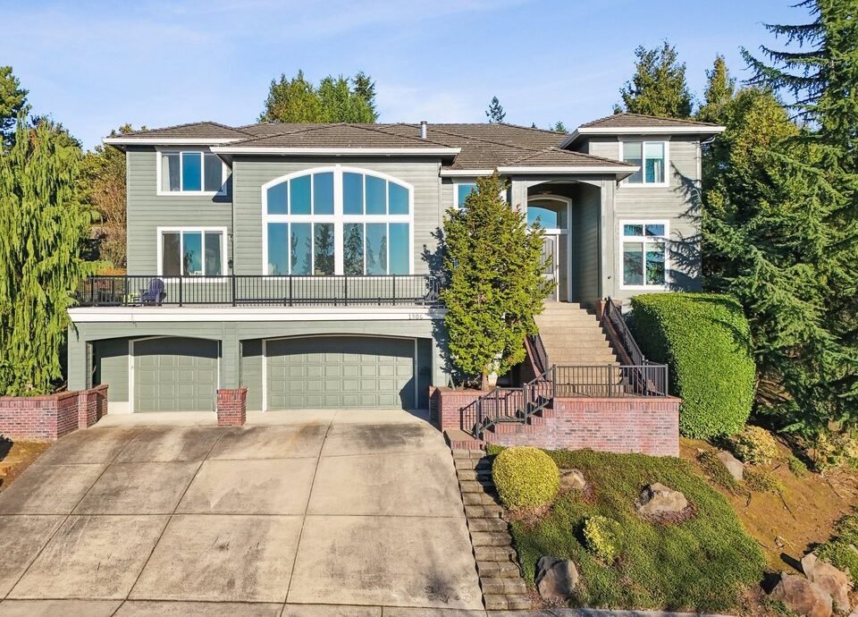 Large hillside home with composition shingle roof in Highland, WA