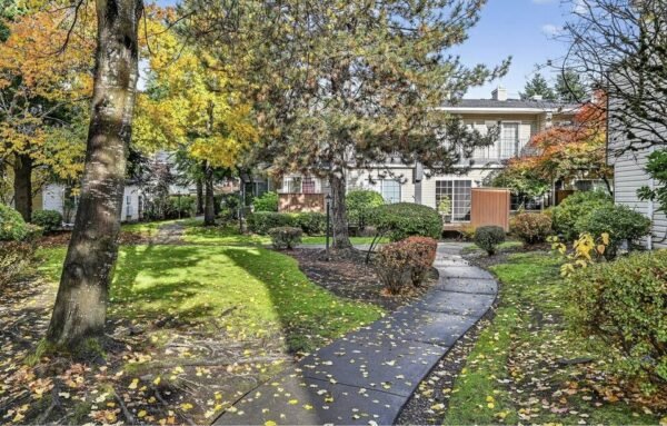 Walkway through fall foliage leading to condo building in Salmon Creek, Vancouver WA